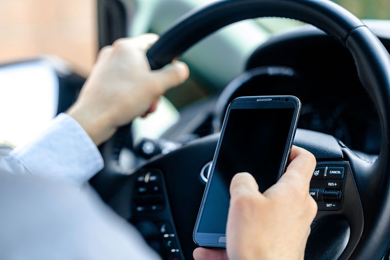 Distracted Driving: Protect Yourself with Auto Insurance & These Prevention Tips